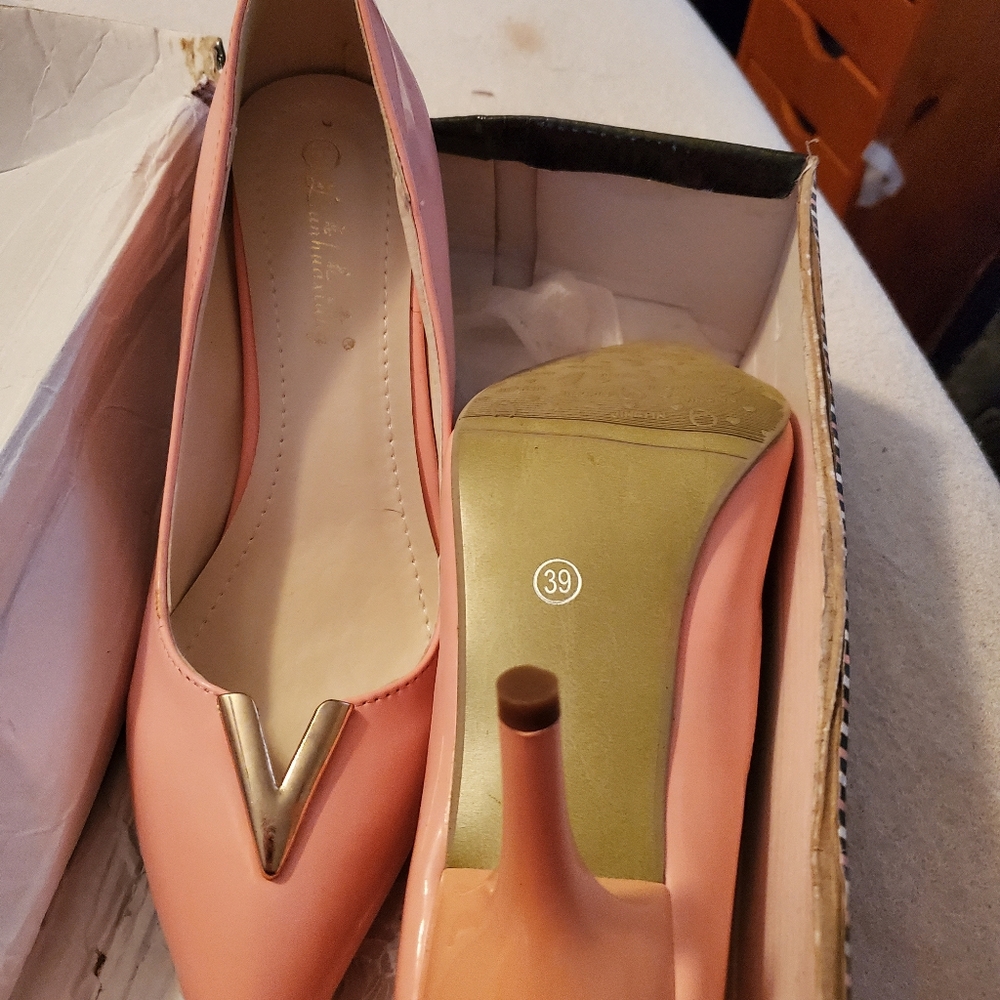 Pink patent pumps